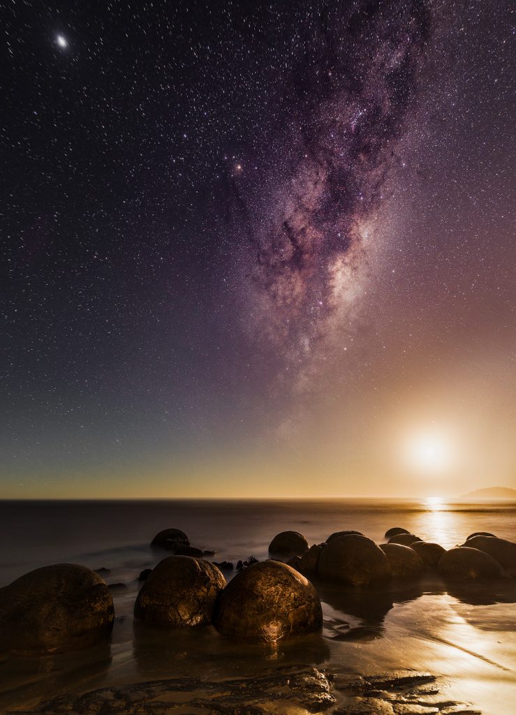 Moon rise over the Moeraki Boulders in New Zealand South Island Coast